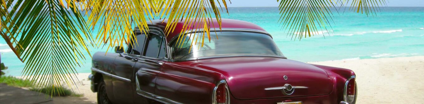 Cuba Beach classic car and palms